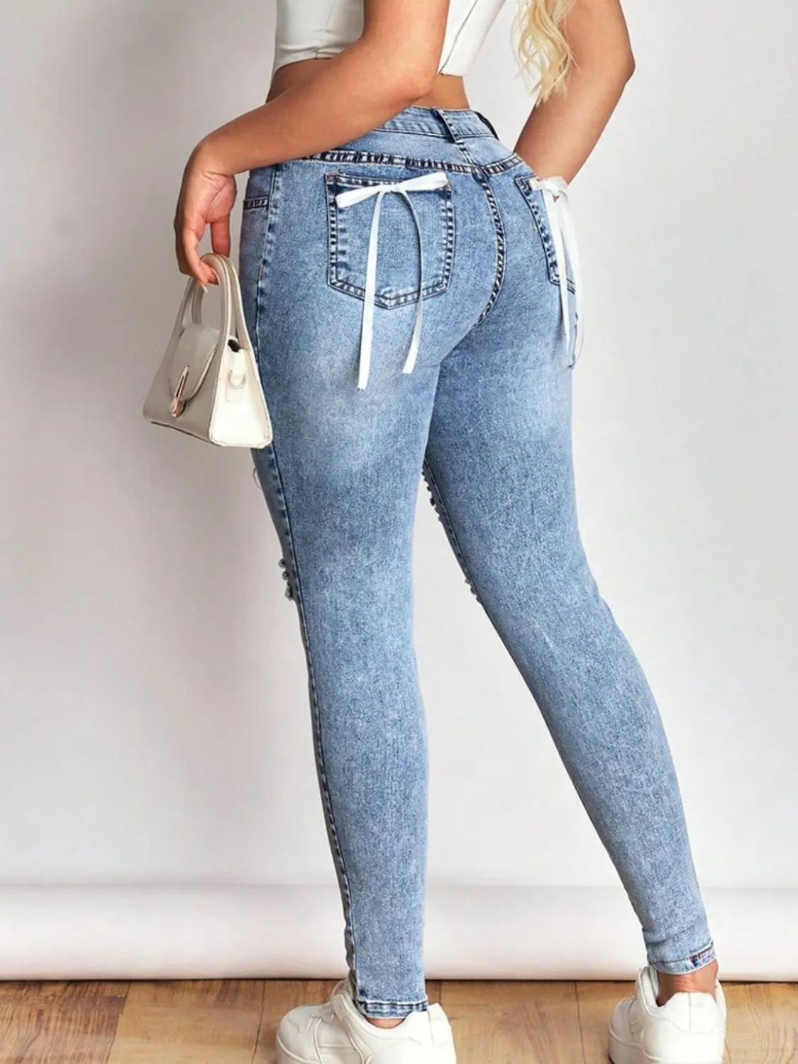 Light wash skinny jeans full length styling