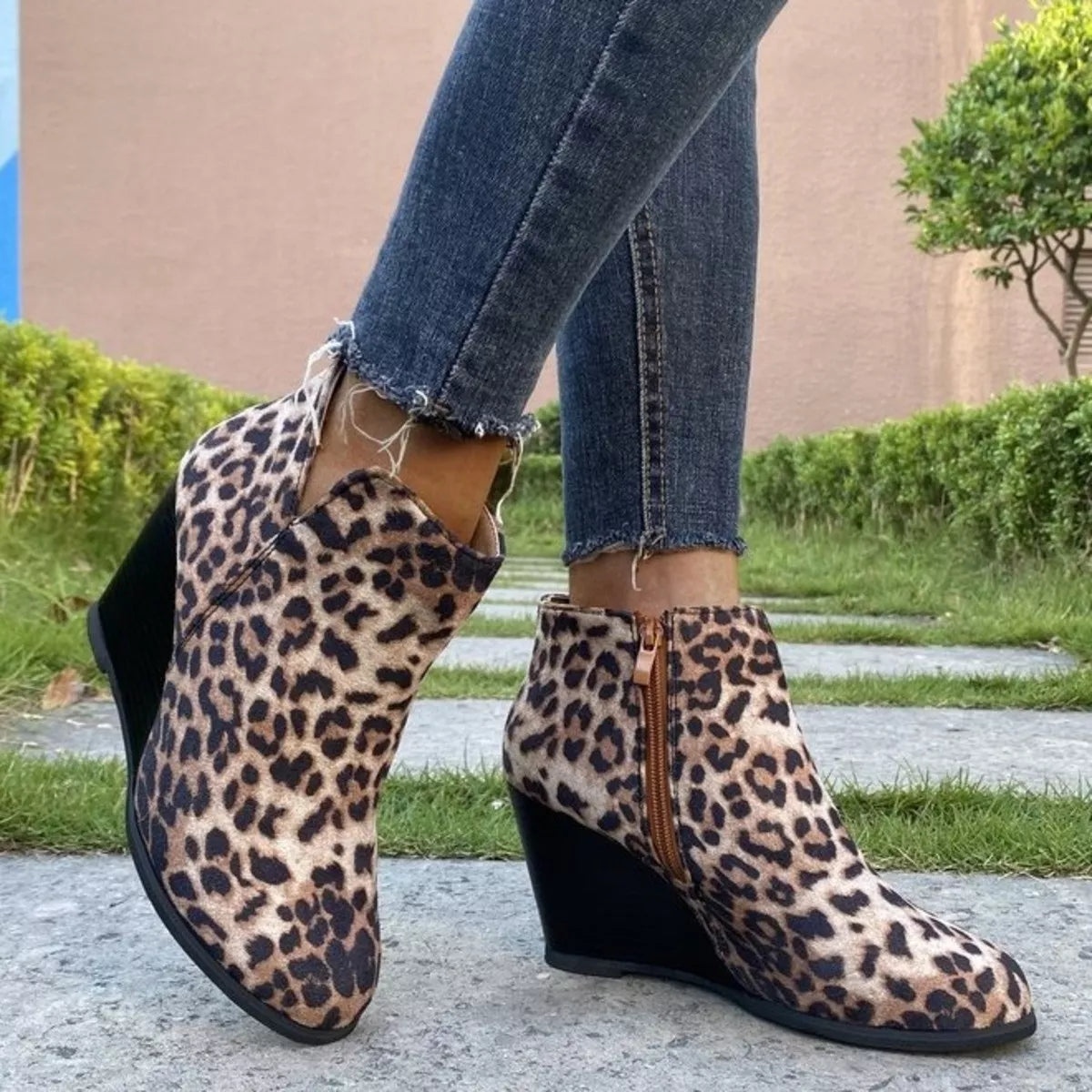 Round toe wedge ankle boots standing pose