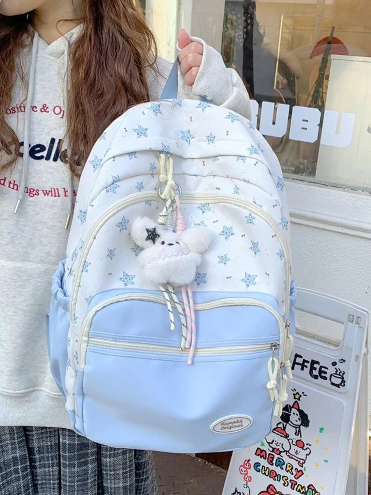 blue star print nylon backpack side profile