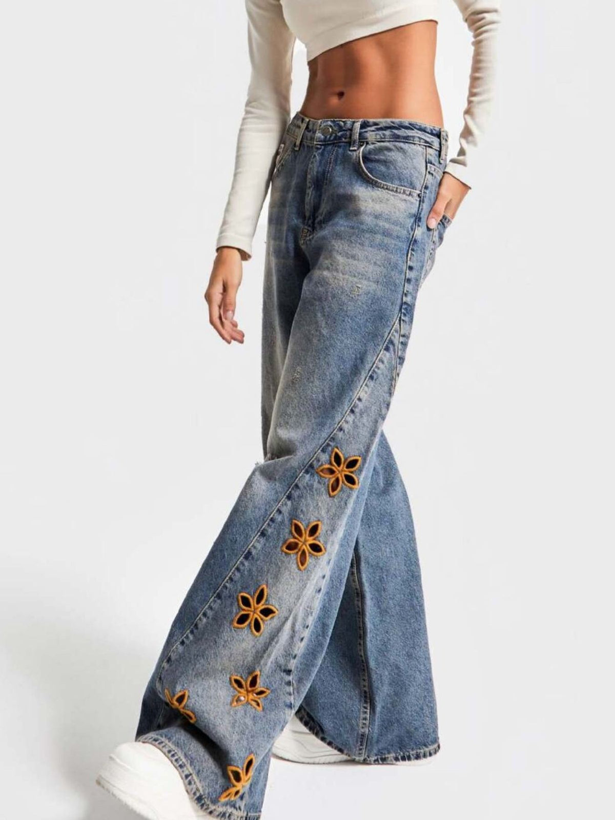 Back view of embroidered wide leg denim