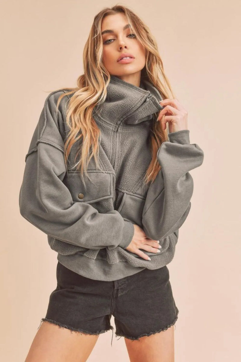 Dark gray exposed seam half zip sweatshirt front view