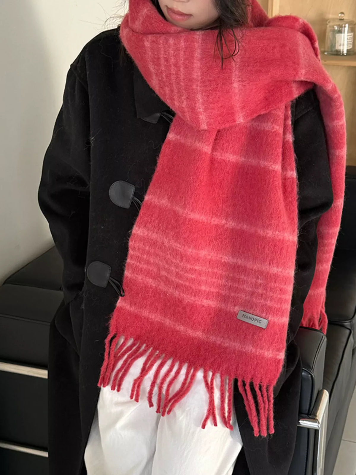 Detail of the soft texture of the striped scarf