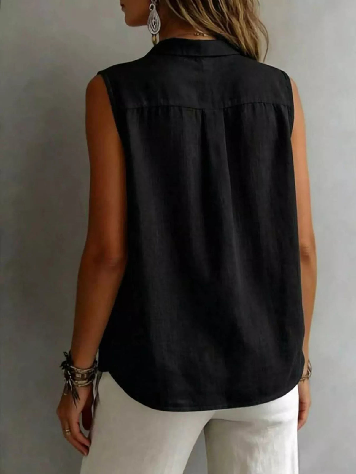 Sleeveless collared button down shirt side view