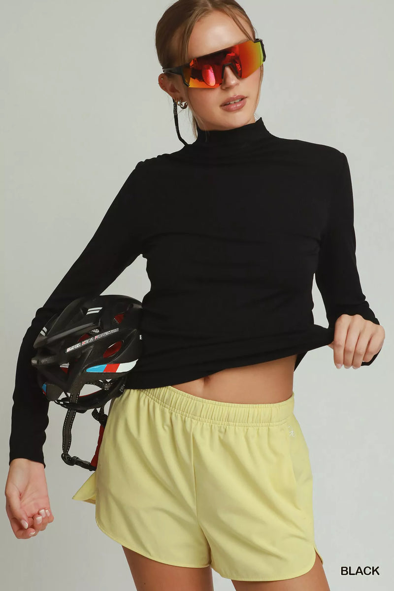Black long sleeve mock neck top, front view