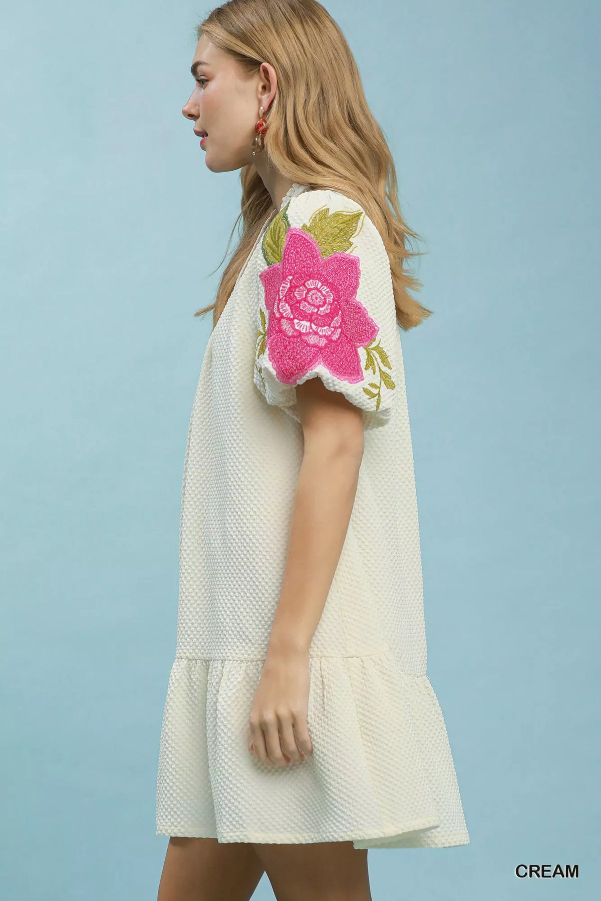 Cream textured jacquard mini dress split V neckline side view