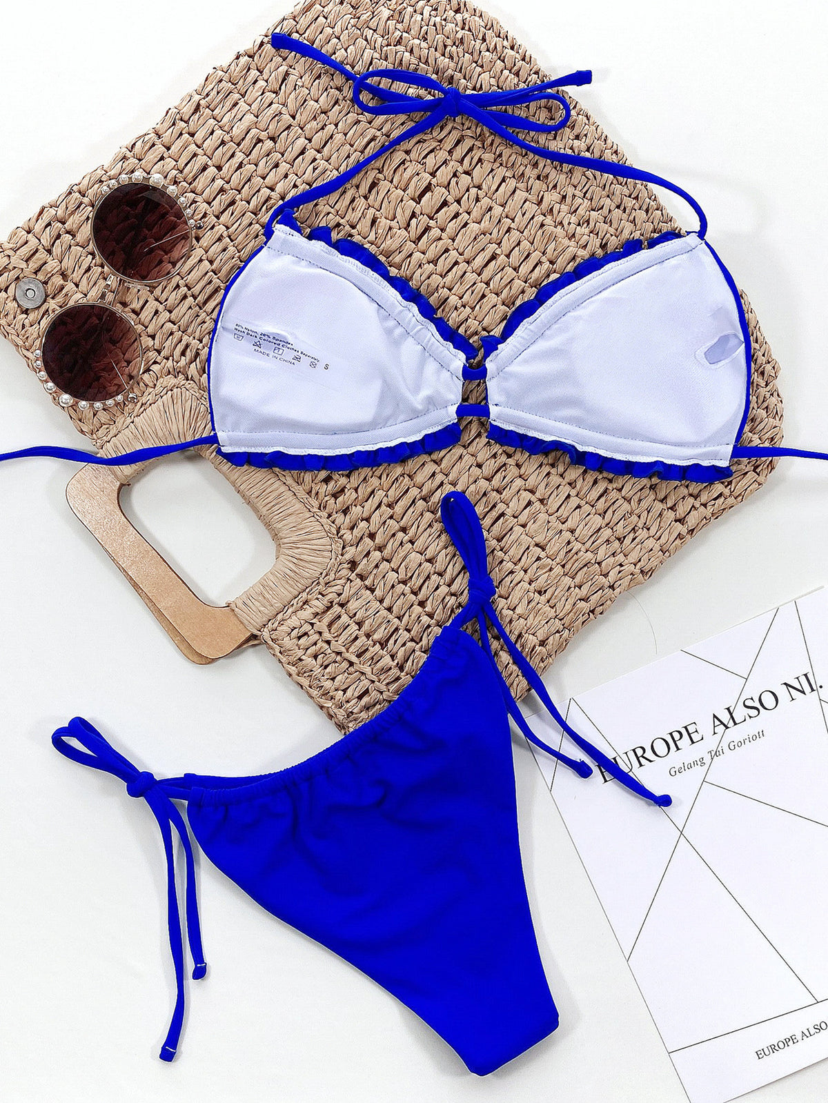 Black halter neck bikini set on model