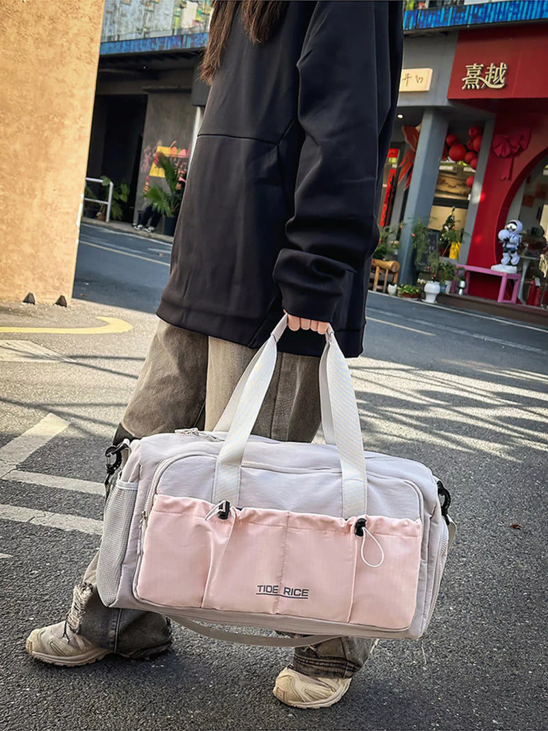 Pink drawstring nylon travel duffel bag front view