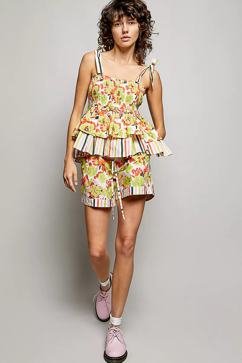 Elasticized waistband and drawstring detail on floral shorts