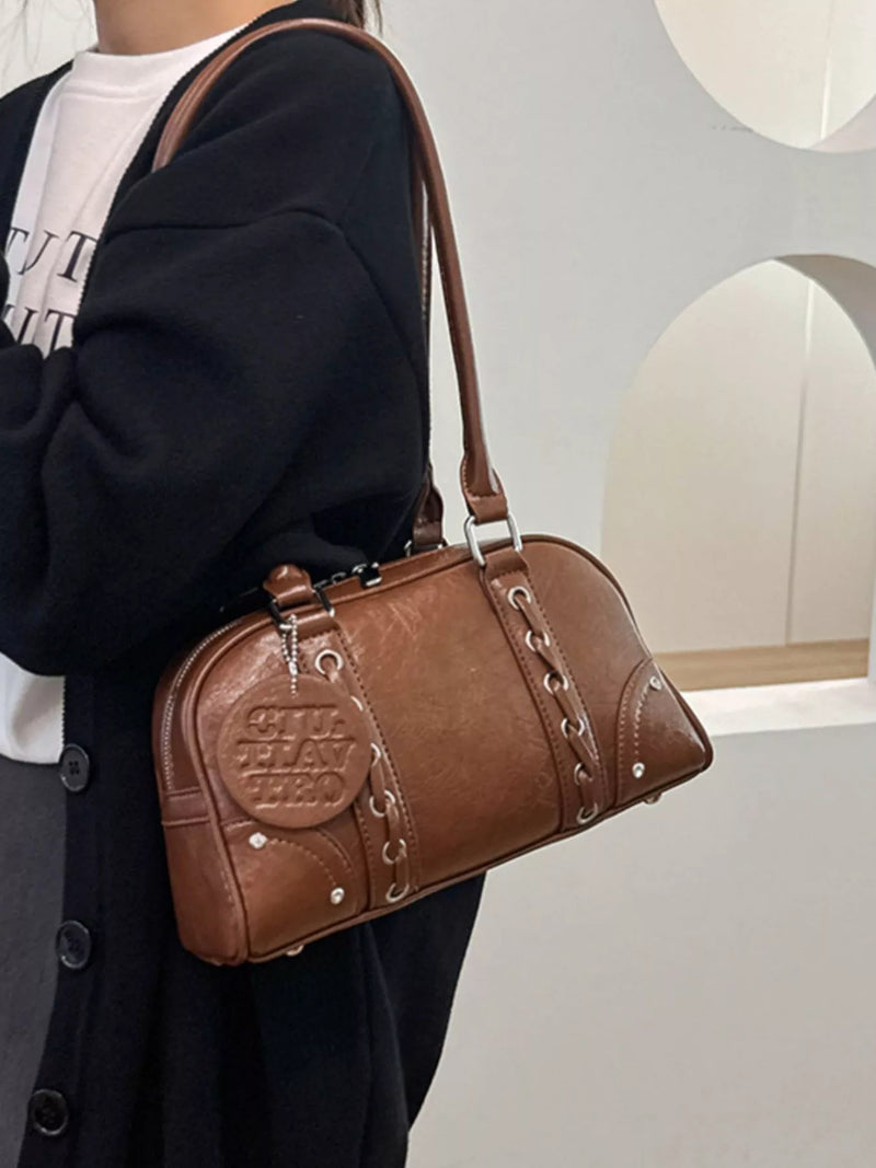 Vintage leather shoulder bag front view in brown