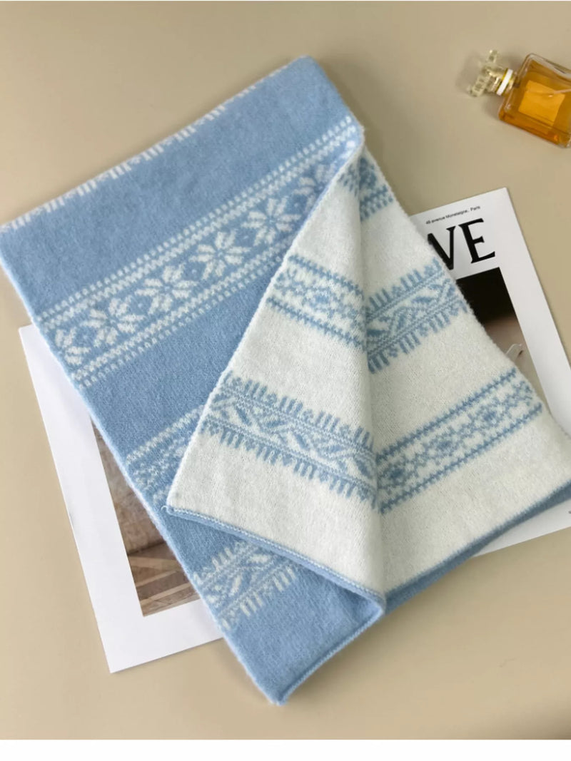 Snowflake knitted winter scarf wrapped around the neck