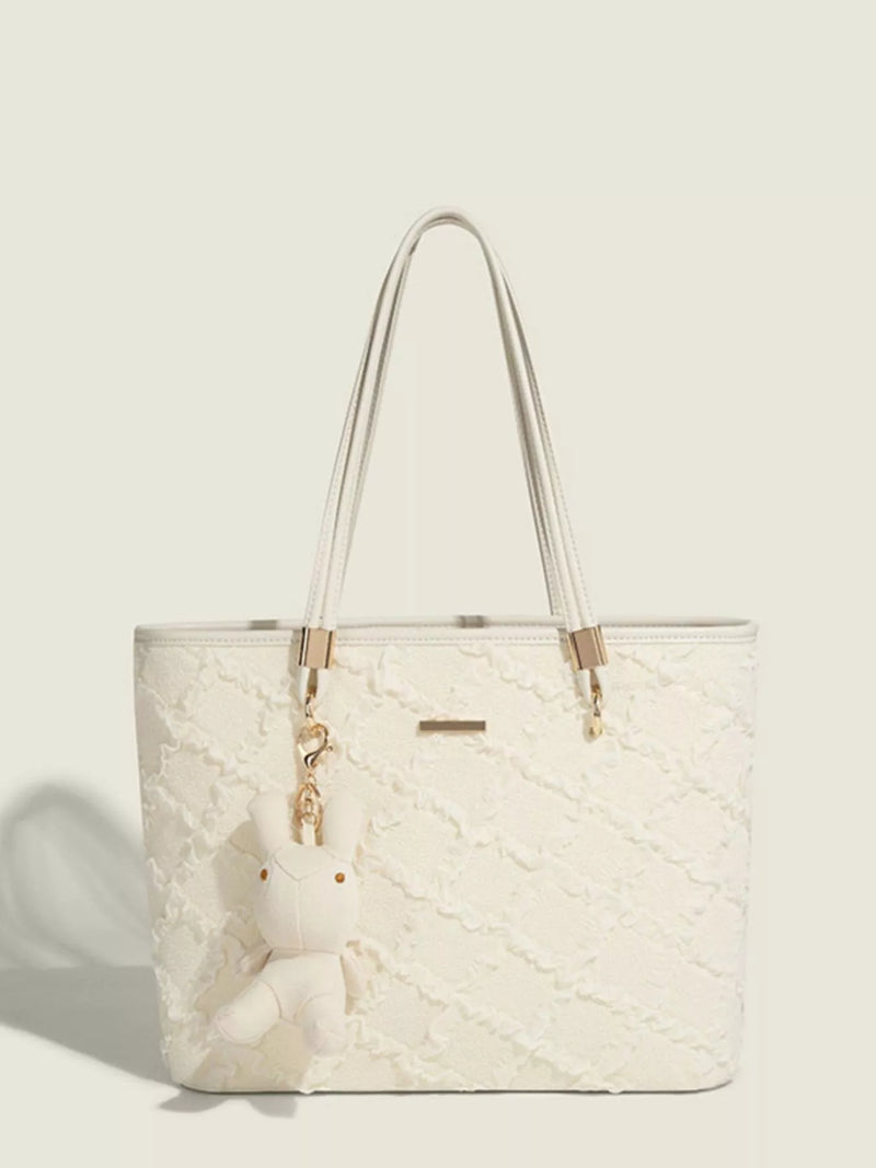 Textured leather tote bag in white front view