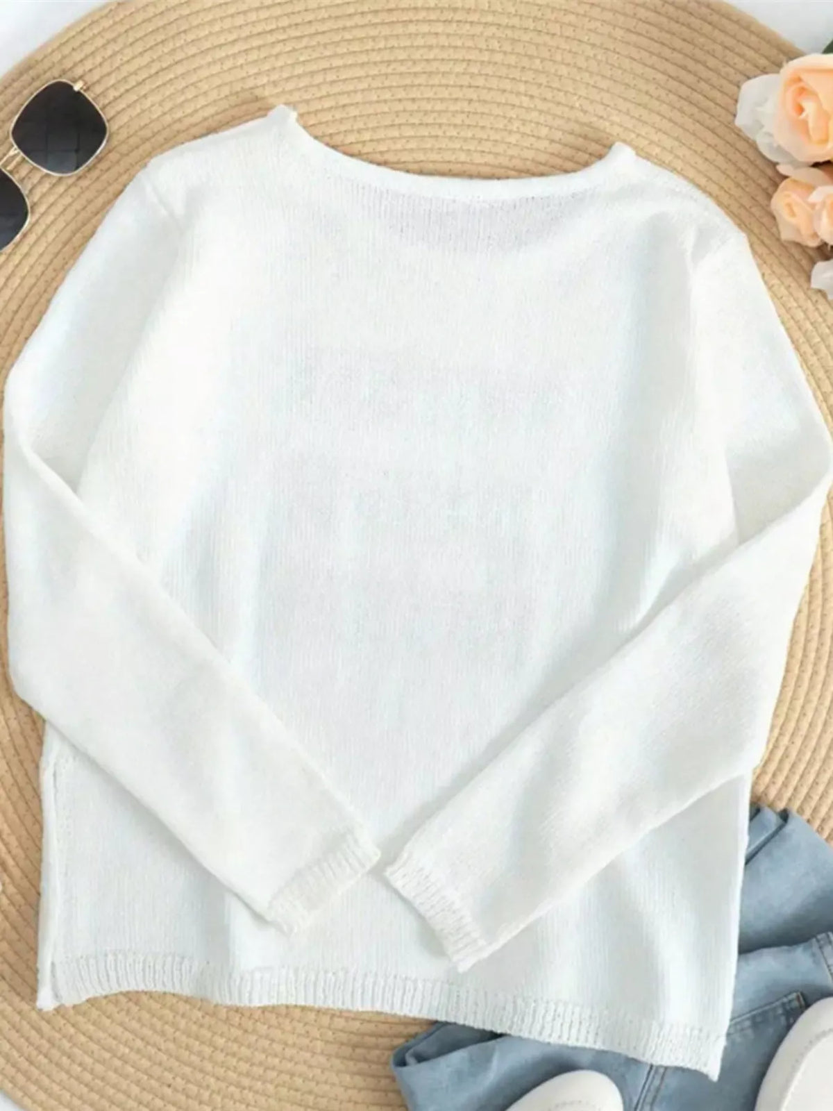 Relaxed white knit top back view