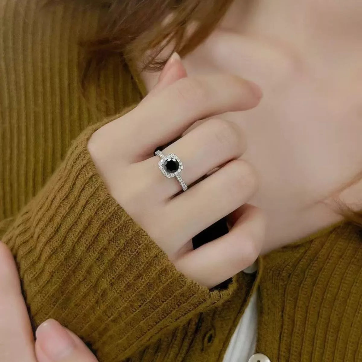 Adjustable silver ring band shown open