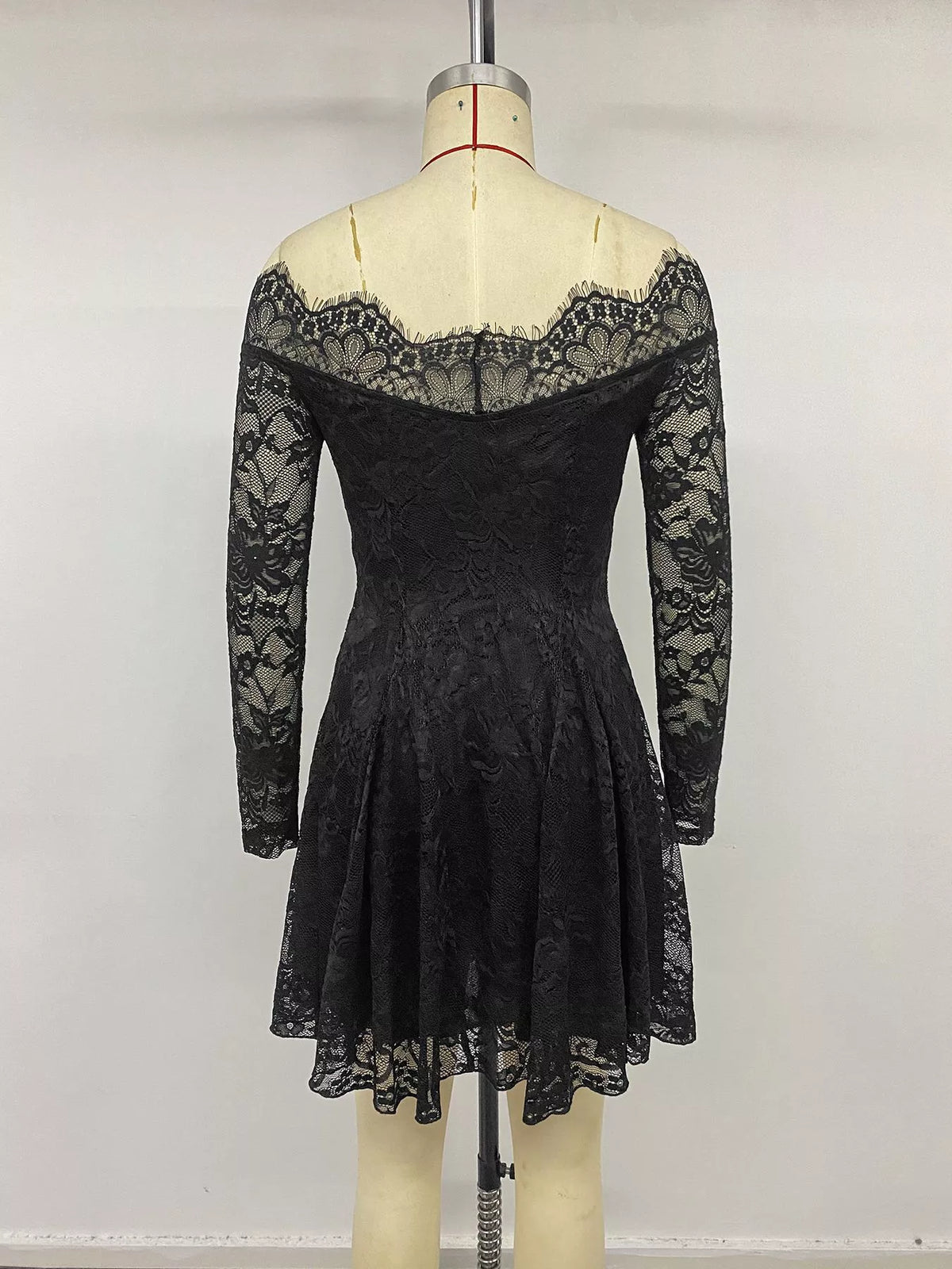 Three quarter view of the off shoulder lace dress