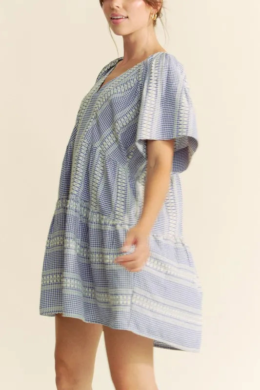 Embroidered Gingham Ruffle Mini Dress in Navy on model