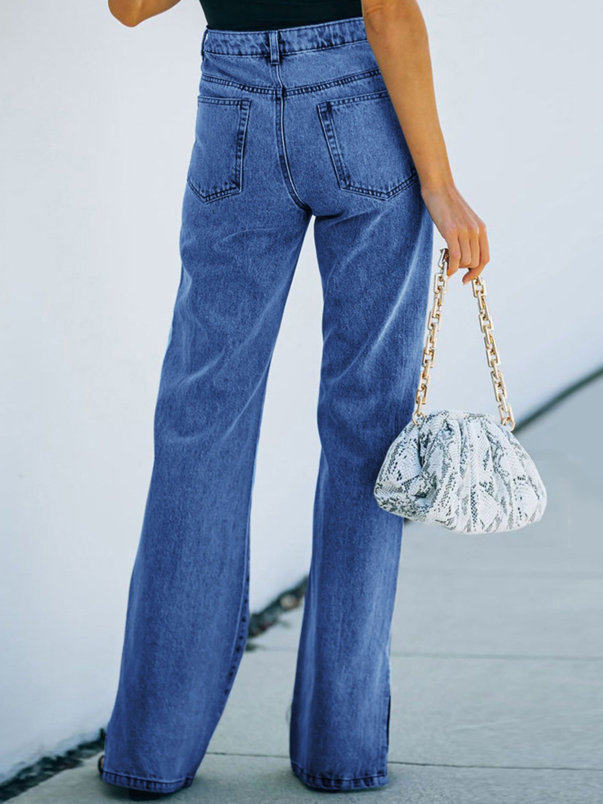 Fluid bootcut denim fabric drape detail