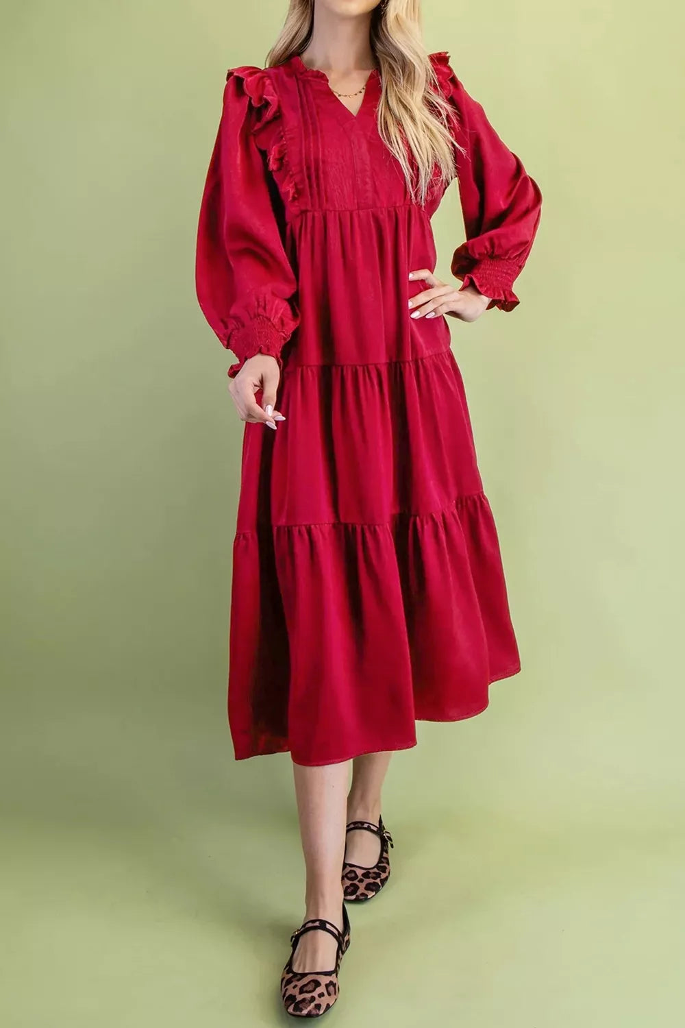 Side view of burgundy shift midi dress showing tiers