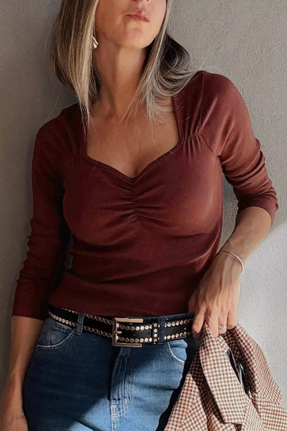 Ribbed long sleeve top side view showing fitted shape