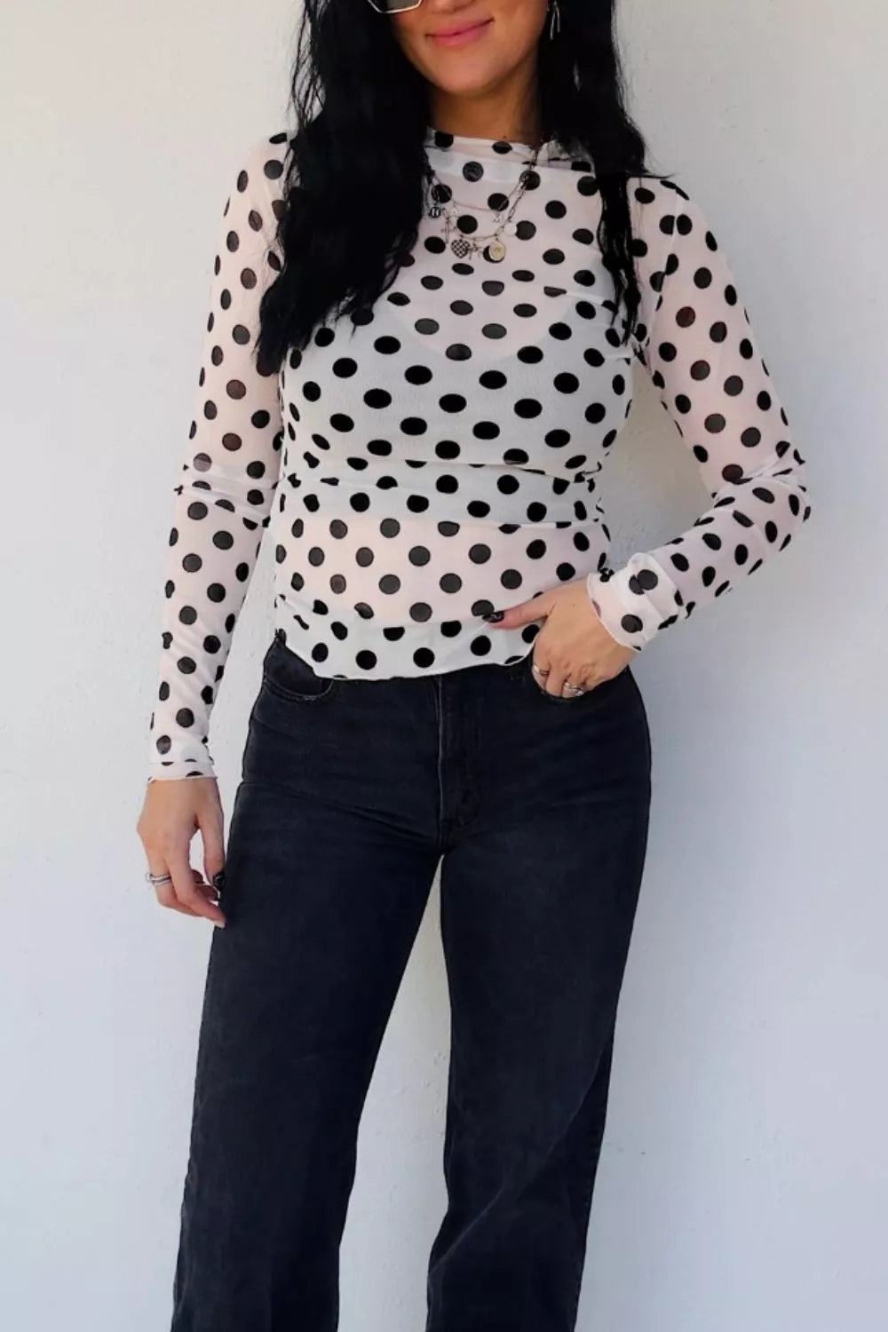White polka dot sheer mesh long sleeve top side view