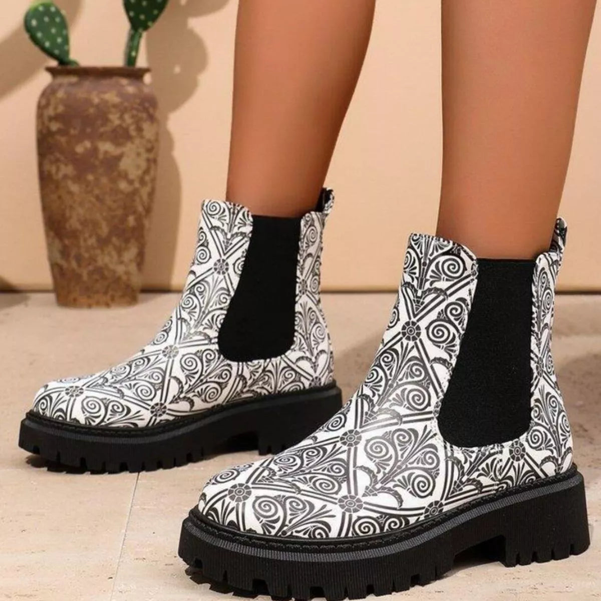 Round toe chunky heel ankle boots paired with an outfit