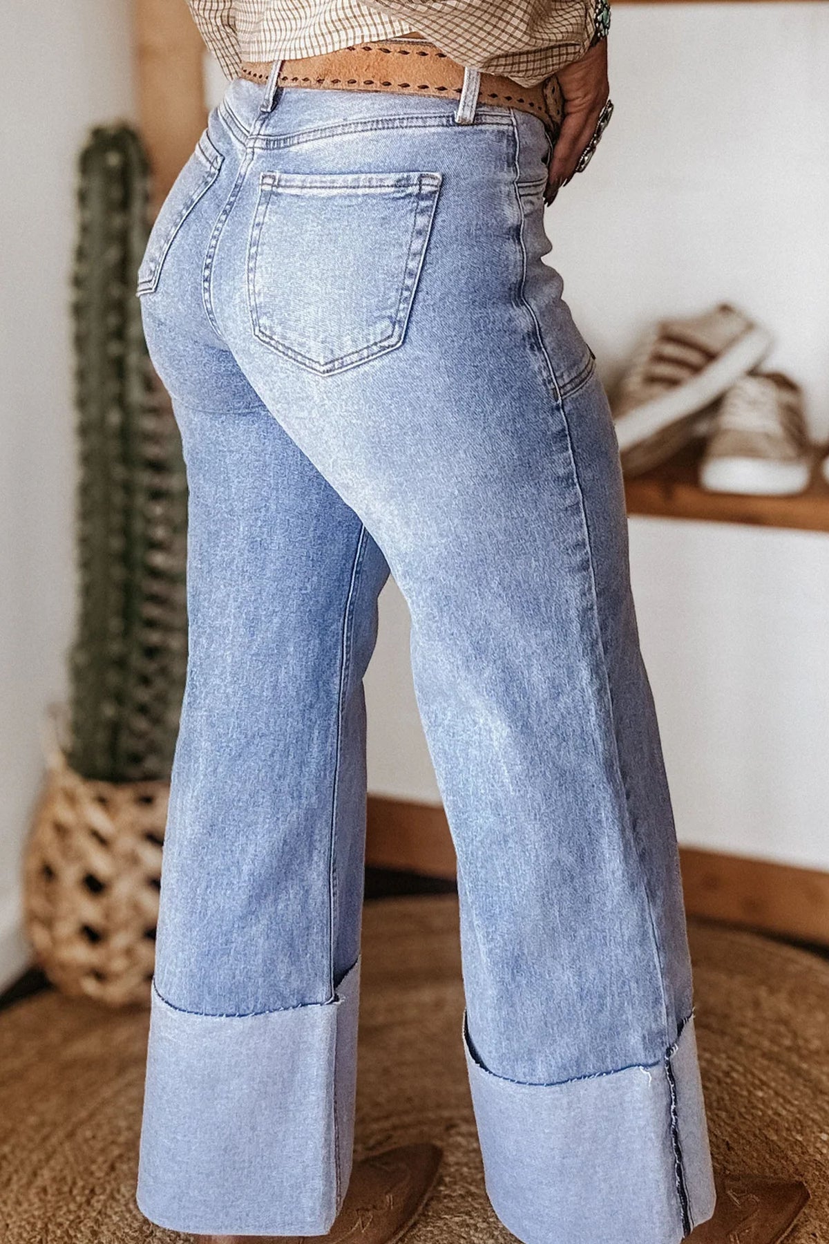 Blue loose jeans styled with a casual top