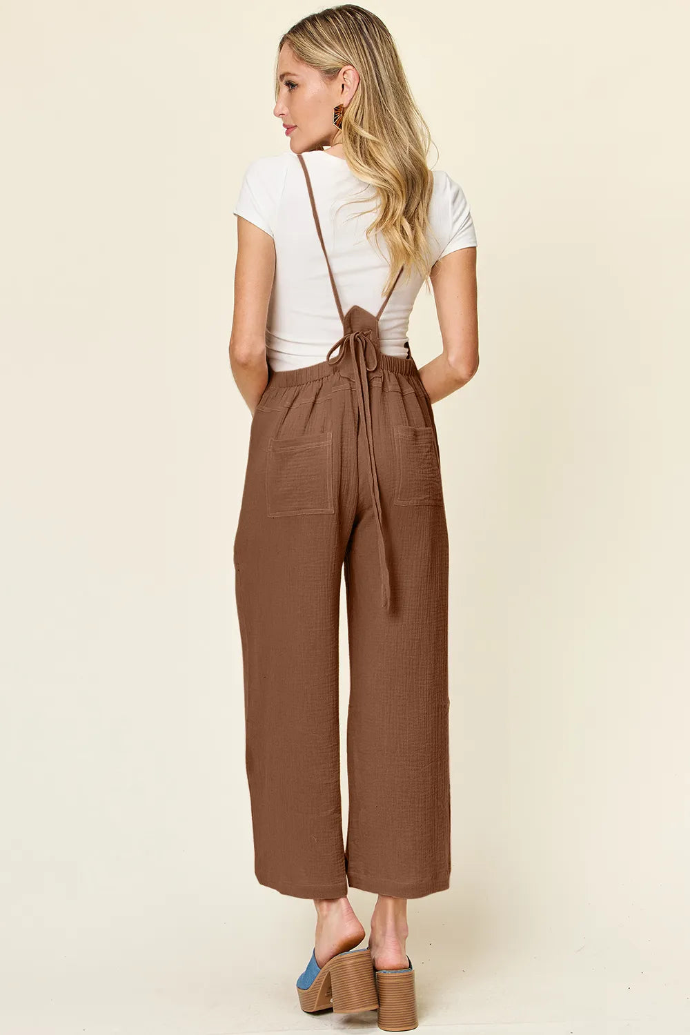 Strap and bib detail of the sleeveless overall