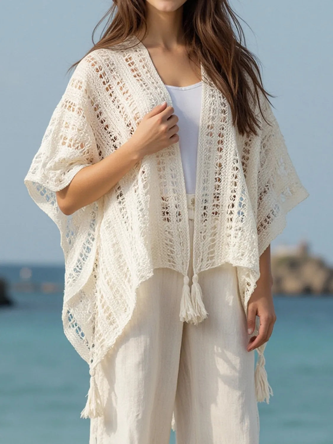 Open front cover up worn on beach