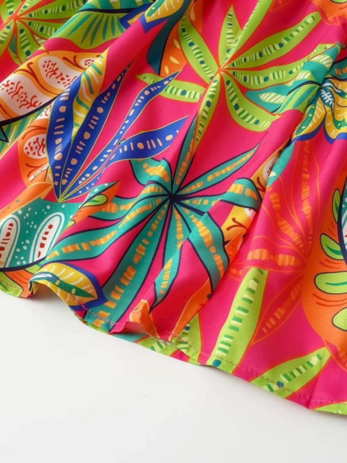 Tropical print smocked tie strap dress side view