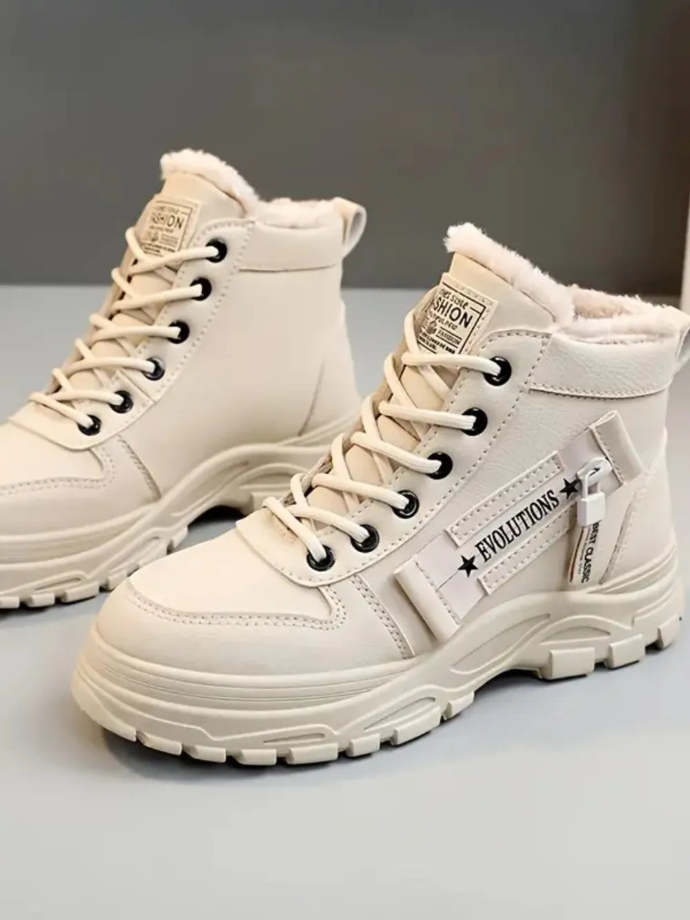 Decorative zipper round toe platform boots angled view