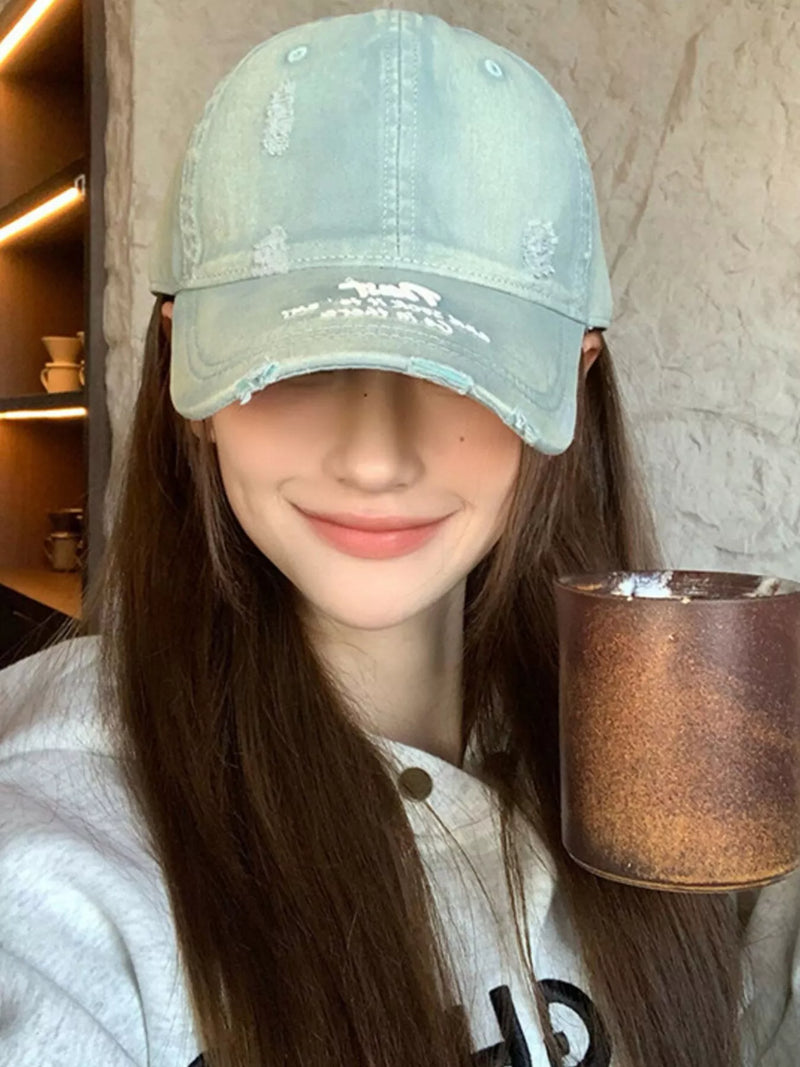 Distressed embroidered baseball cap shown from the front