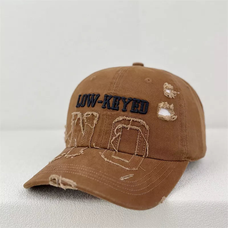 Distressed embroidered baseball cap, front view