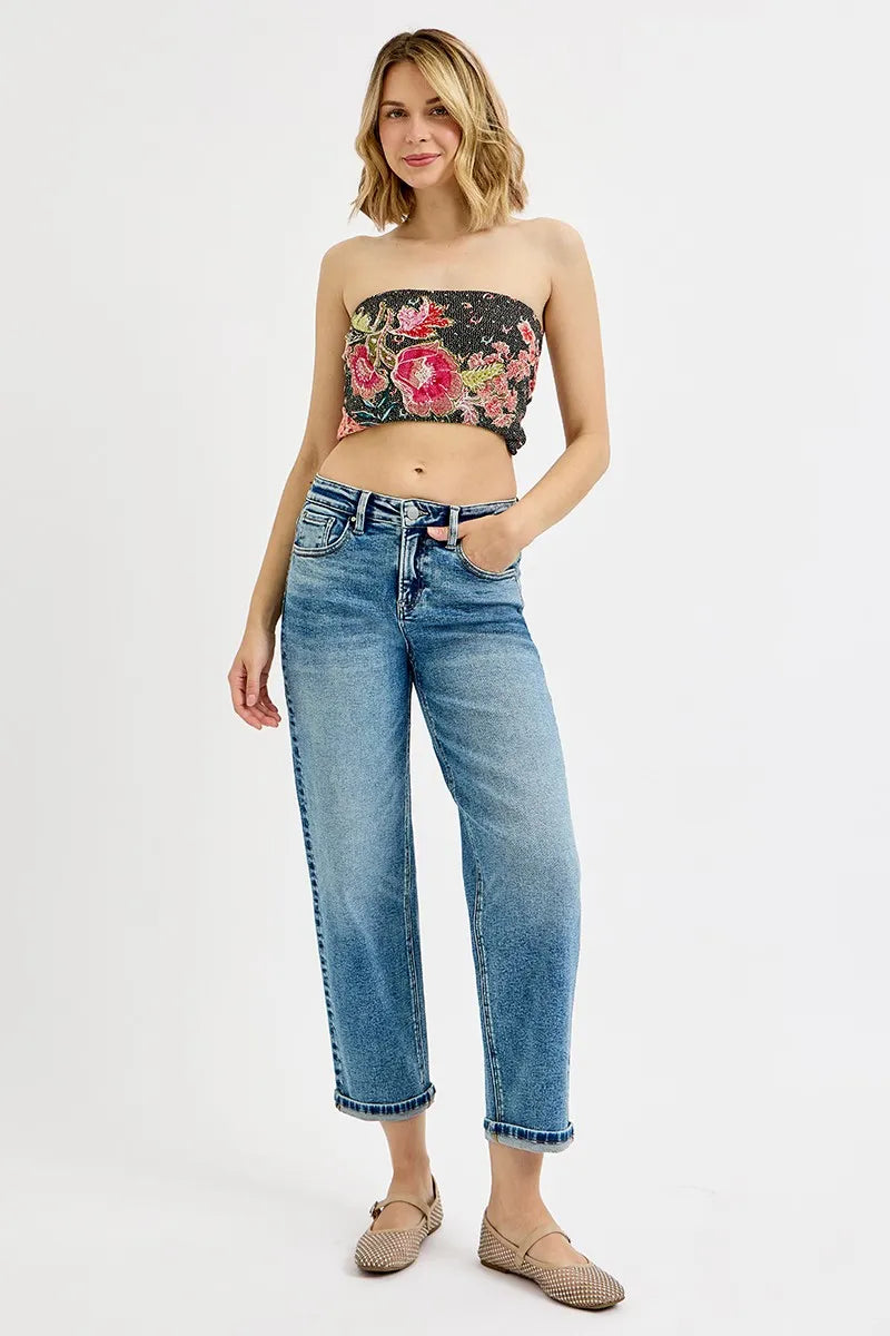Model wearing medium wash crop boyfriend jeans