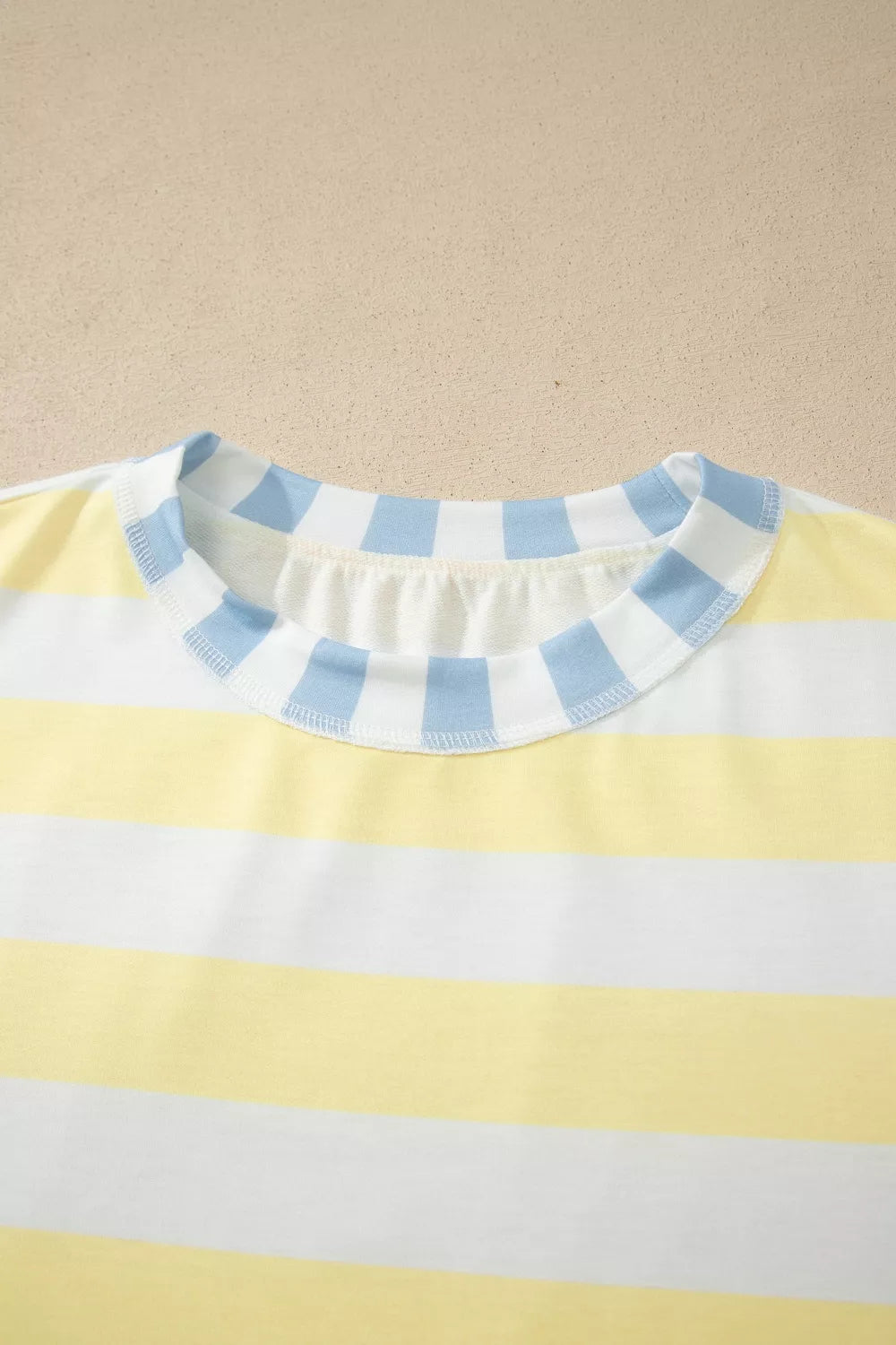 Womens striped top shown full length with denim