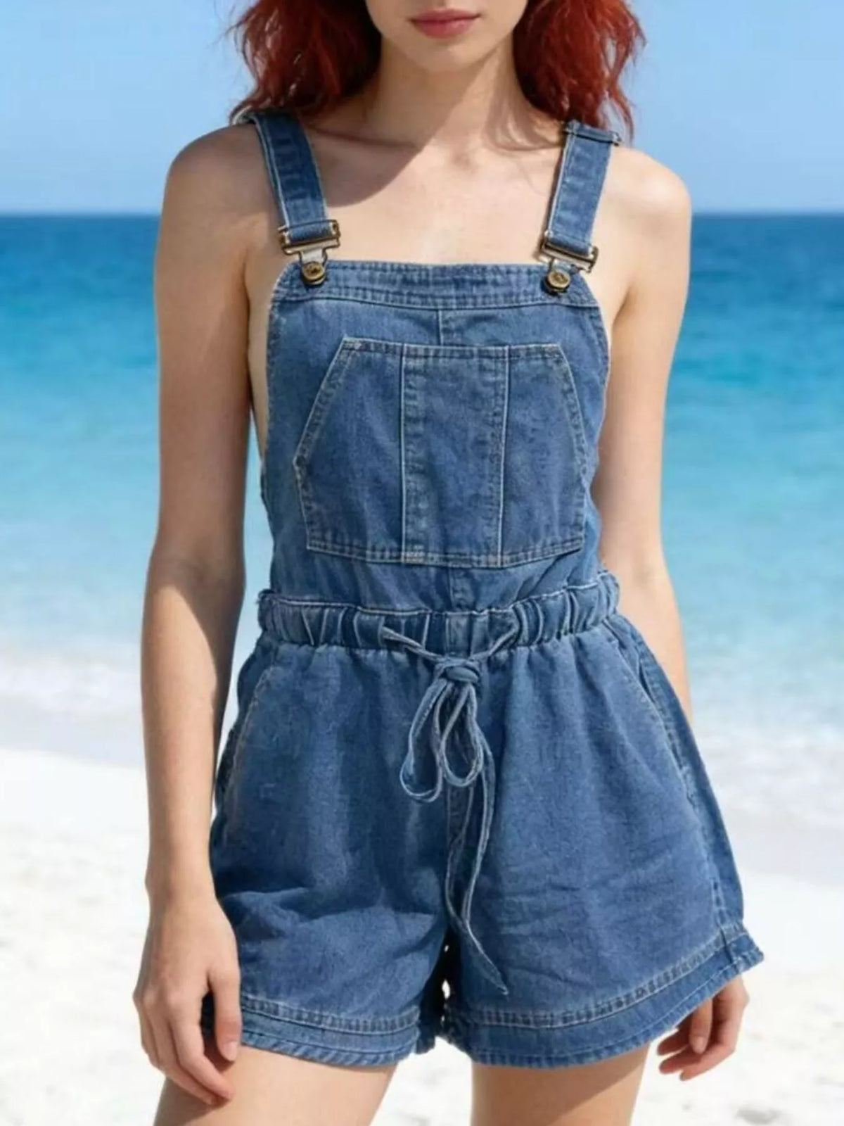 Denim overall shorts back view showing the tie