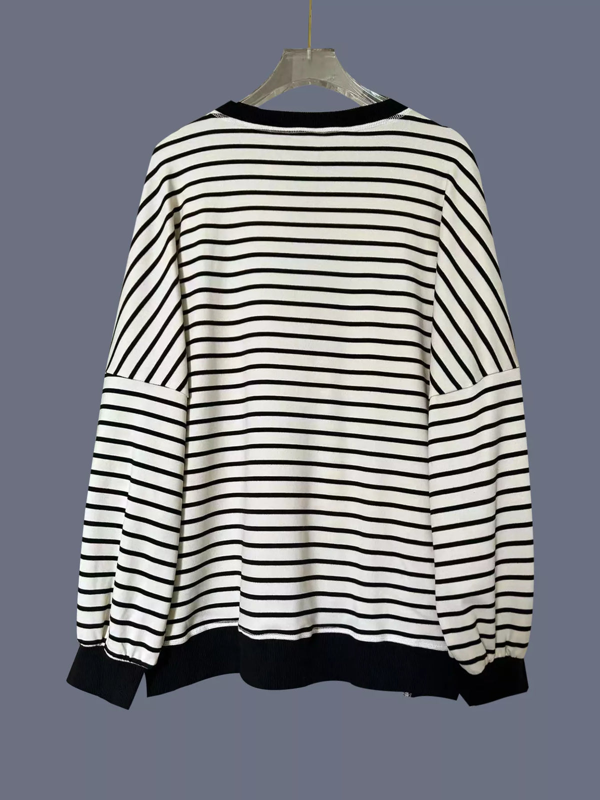 Back view of the striped button detail sweatshirt