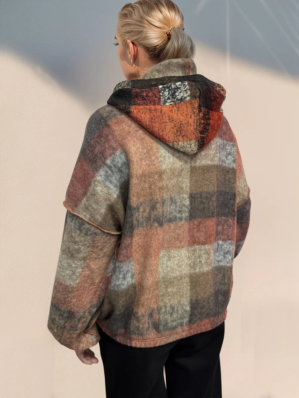Back view of half zip exposed seam hoodie