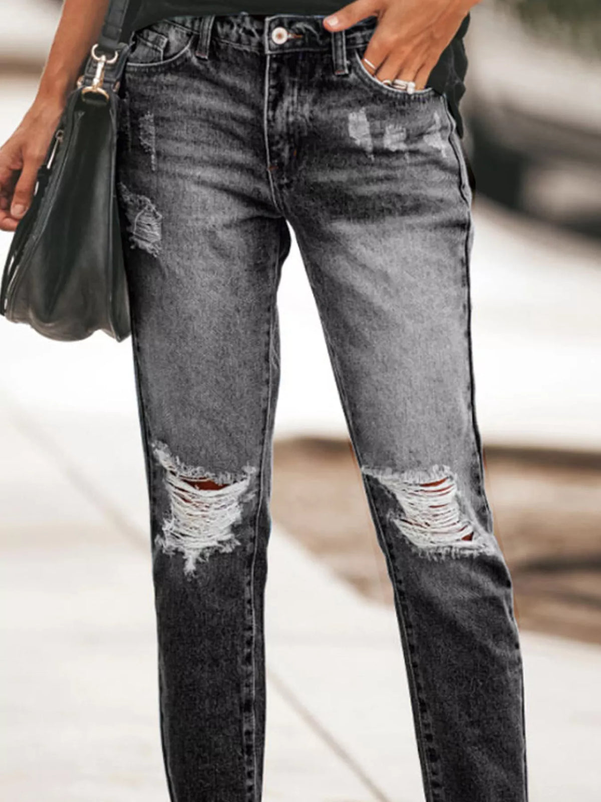 Back view of distressed ankle denim
