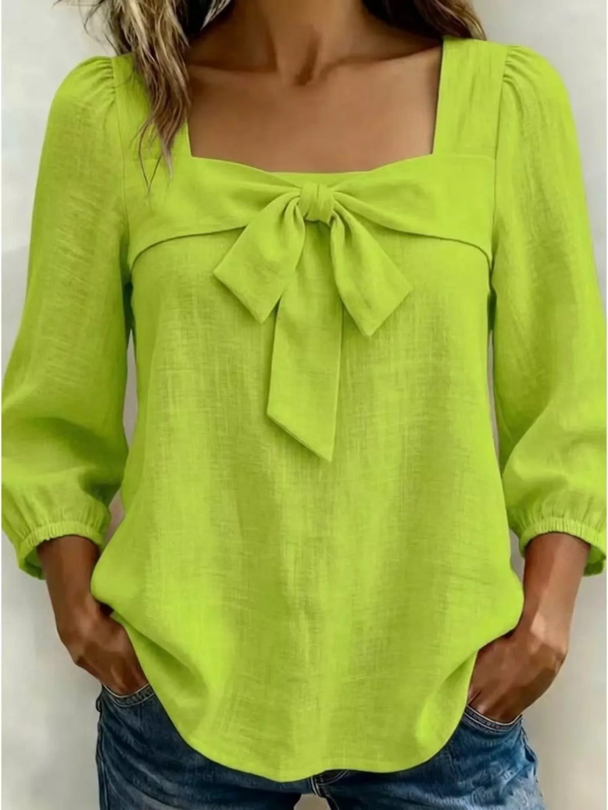 Green bow front blouse front view