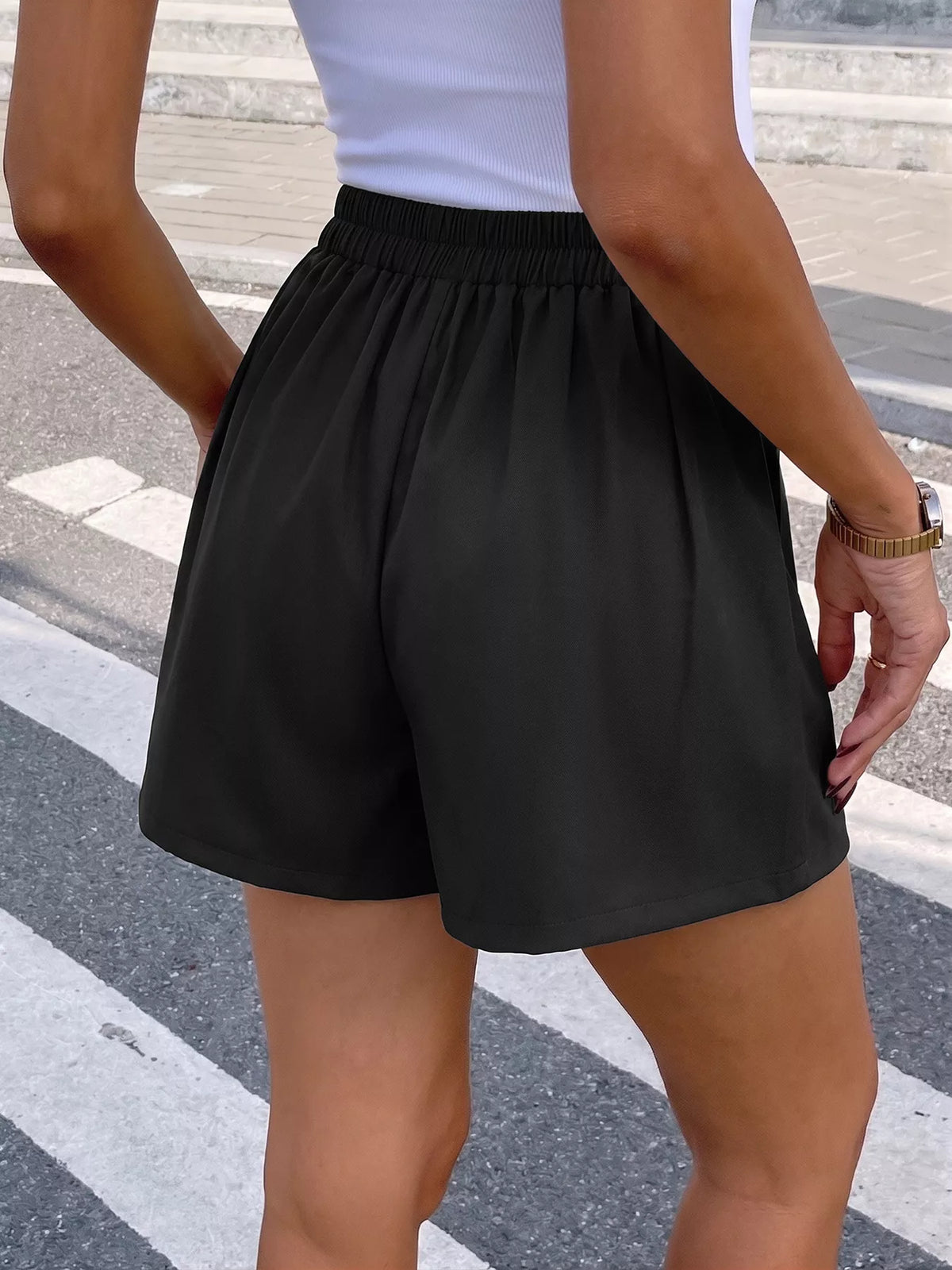 Black high waist pleated shorts styled view