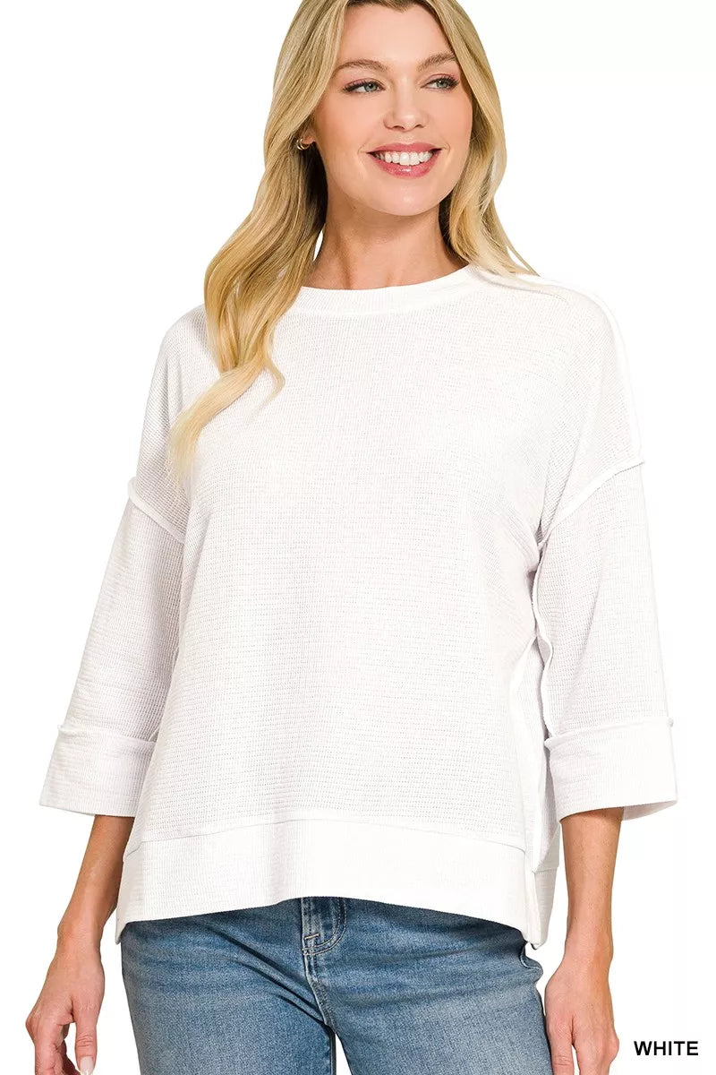 White 3/4 sleeve knit top on model