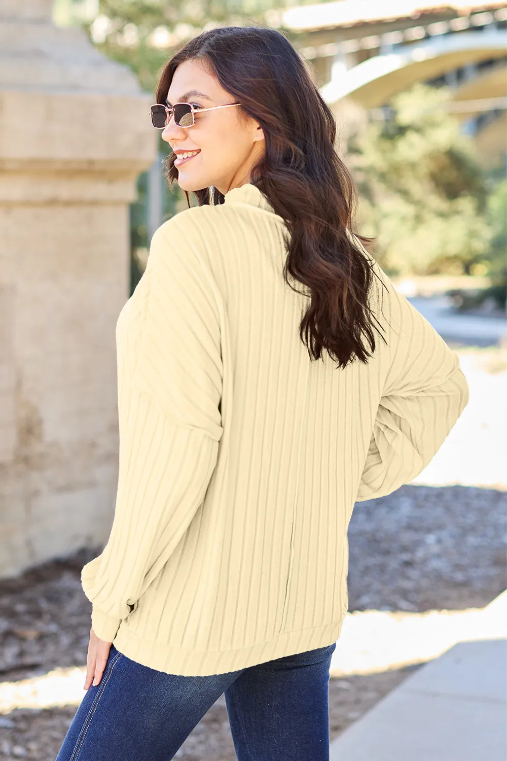 Ribbed knit top shown in a soft neutral colorway