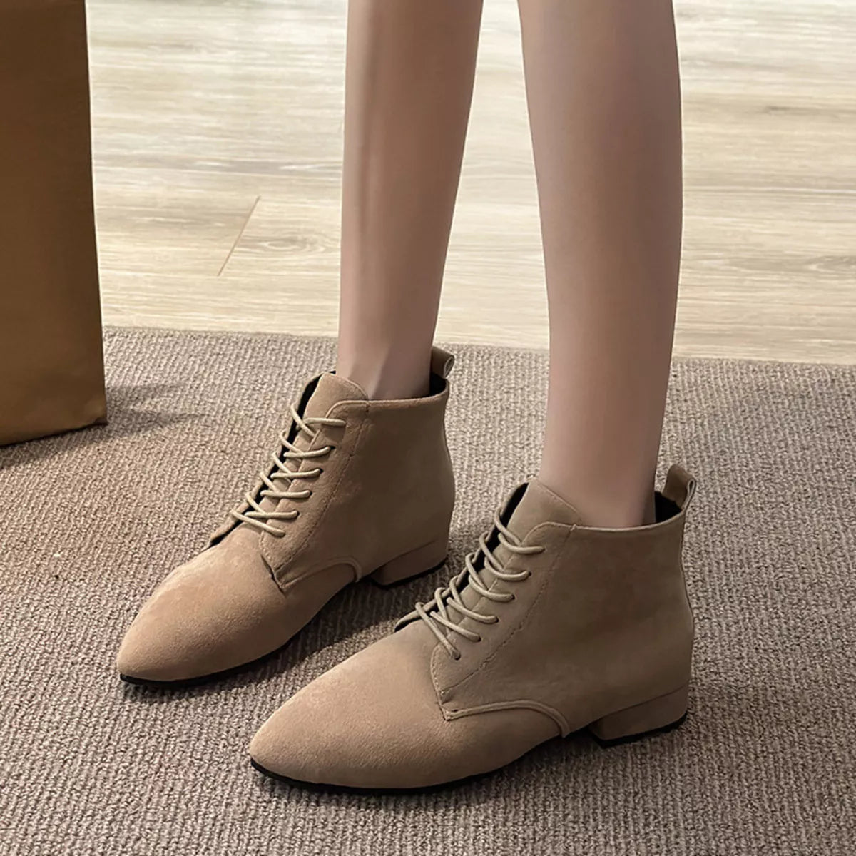 black point toe block heel boots styled on model