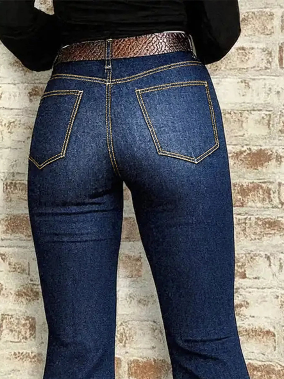 Dark blue flare denim high rise detail