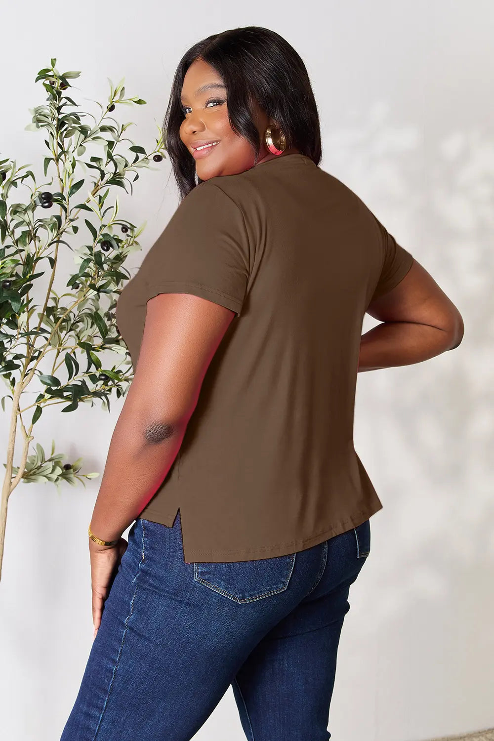 Plus size tee styled tucked into jeans