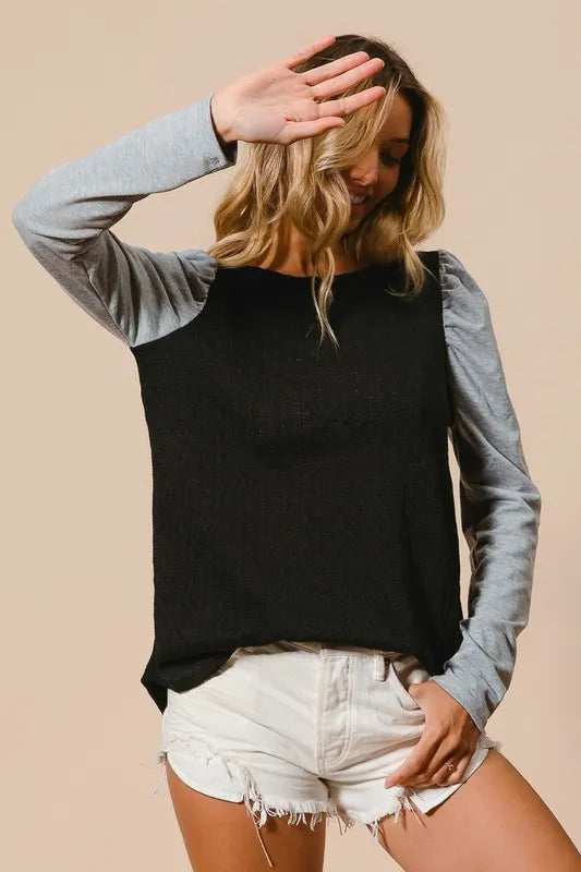 Cable Knit Top with Contrast Puff Sleeve in Black on model