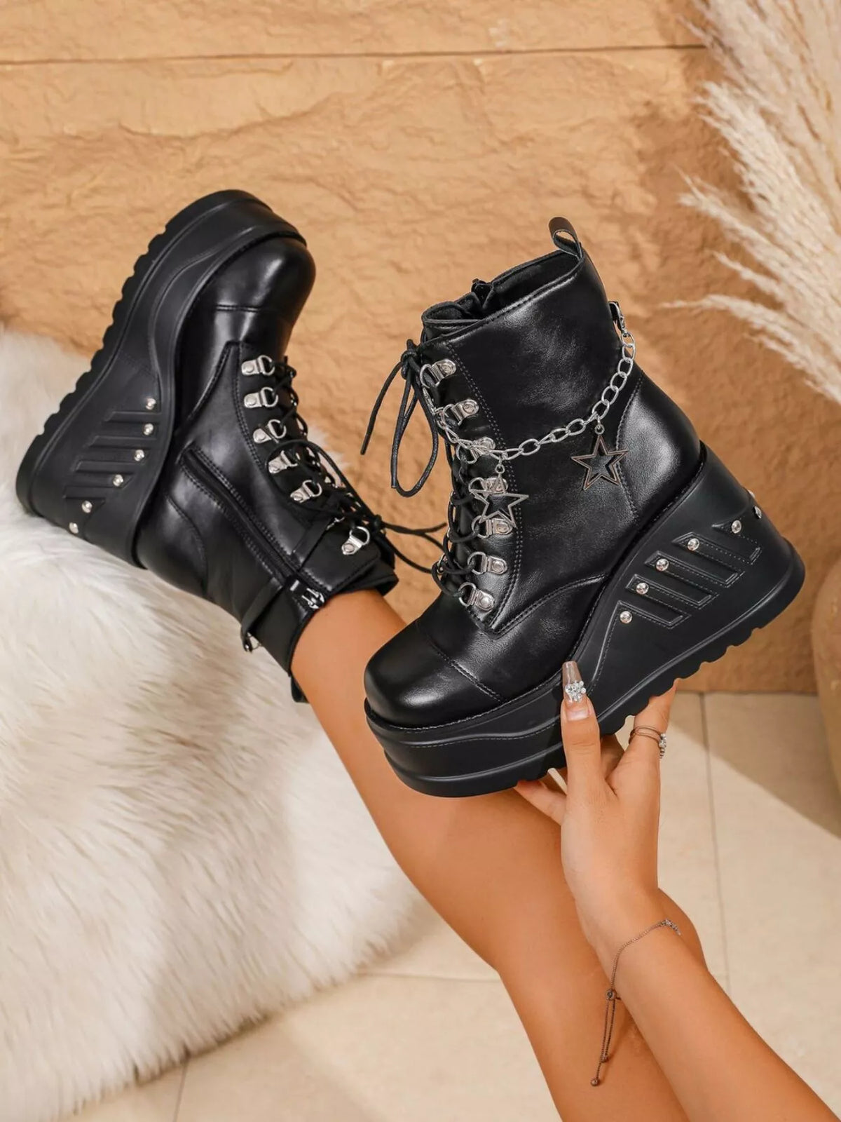Black platform wedge boots side profile