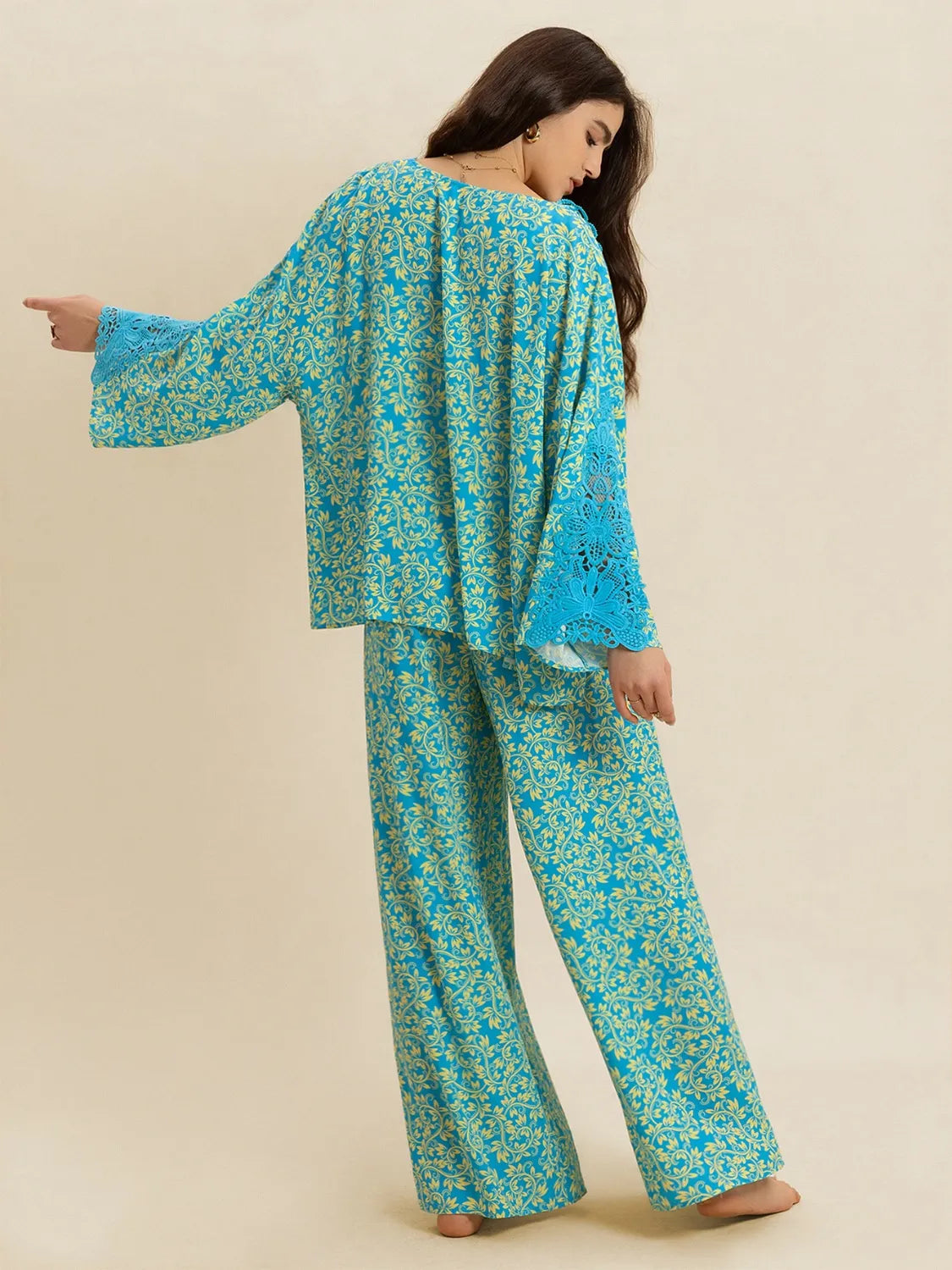 Matching teal printed pants of the set