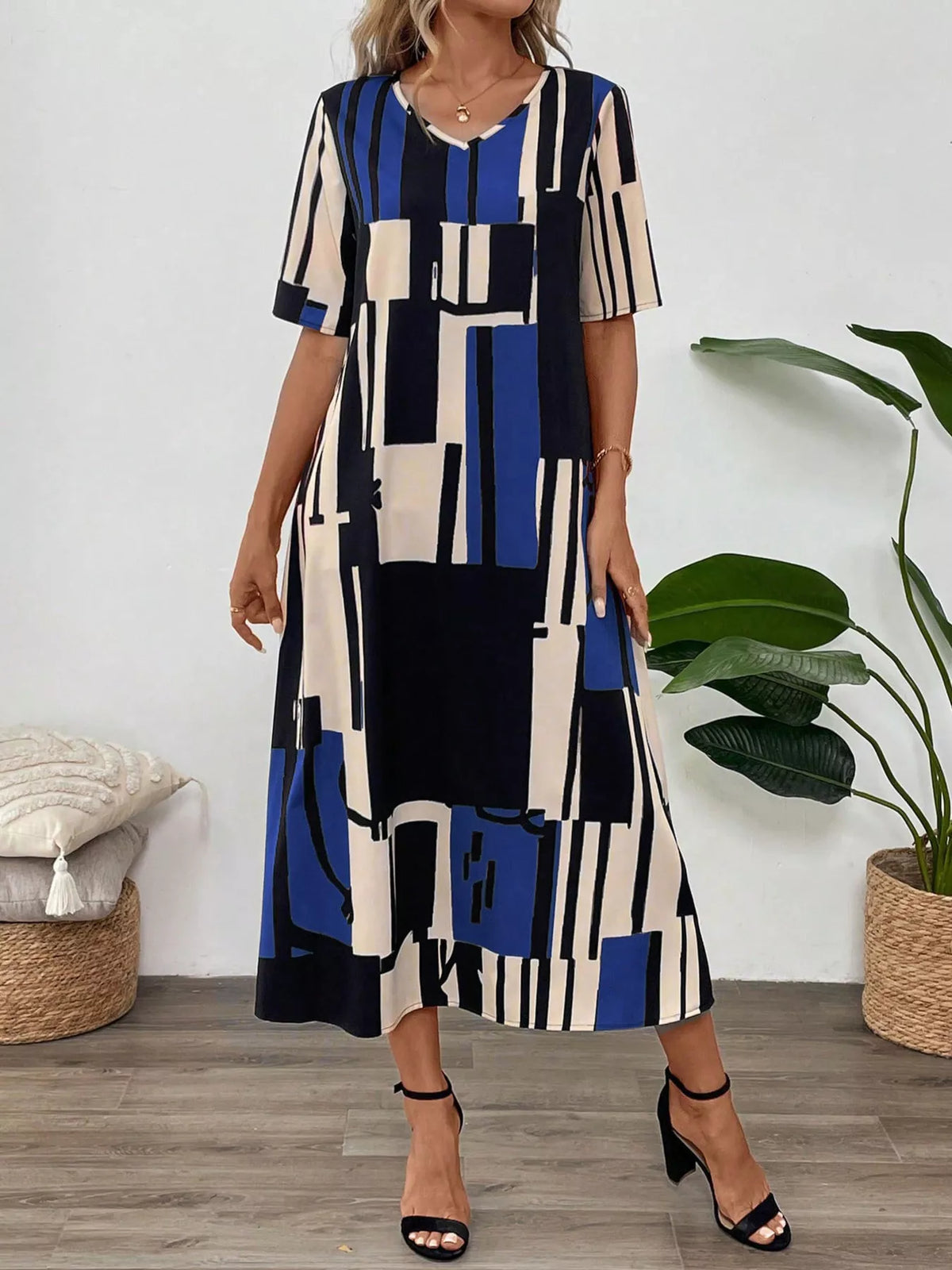 Abstract geometric print v neck midi dress back view