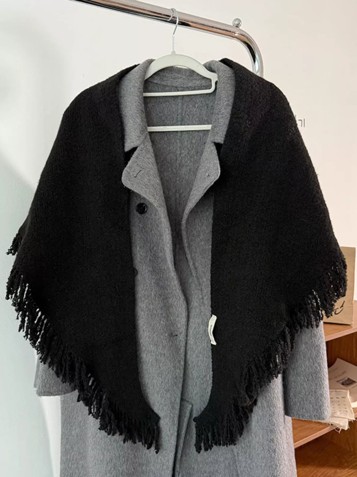 Light gray knit scarf with fringe ends