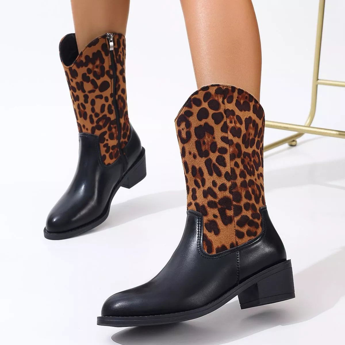 Point toe block heel boots styled with denim